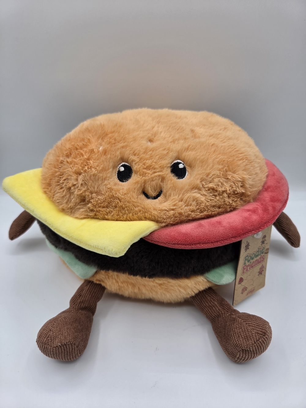 Smiling Plush Burger Toy - Brown with Red & Yellow Accents